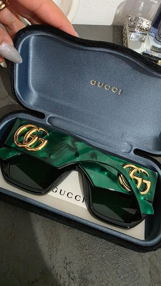 Occhiali Gucci neri e verdi