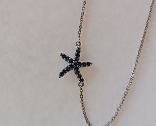 Colgante estrella Plata Ley 925 con circonitas.