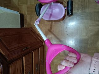Triciclo infantil rosa con barra