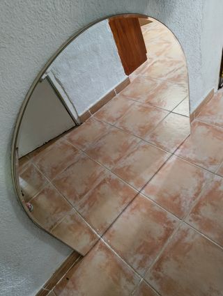 Espejo curvo plateado