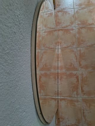 Espejo curvo plateado