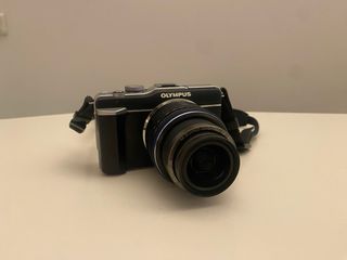 Olympus E-PL1 + zoom 14-42MM