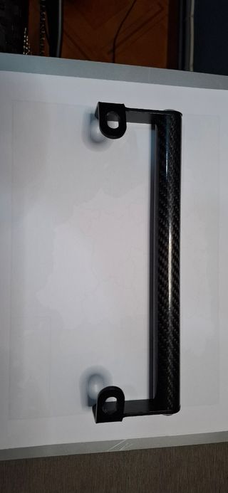 Soporte manillar moto carbono.