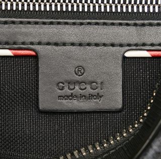 Riñonera Gucci negra y roja