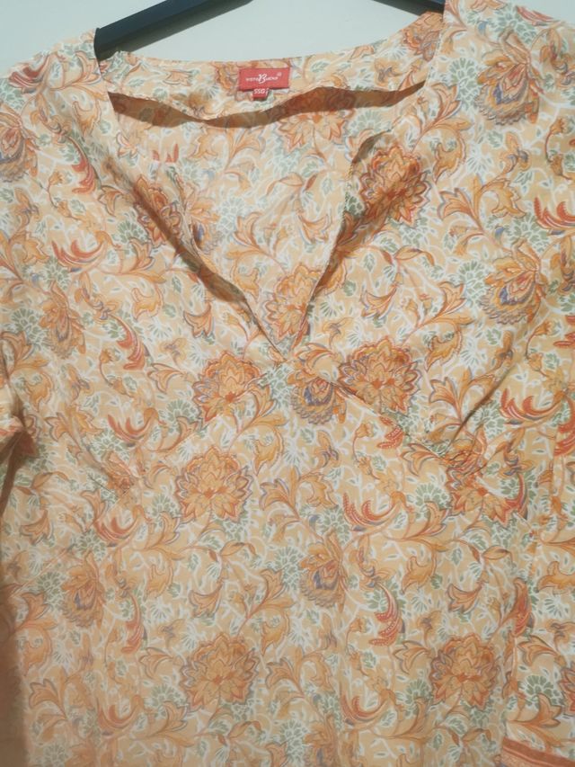 Camisola playa beige y naranja