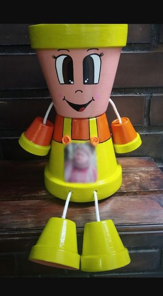 Muñeco de macetas personalizadas con fotografías.