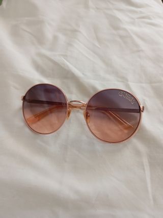 Gafas sol redondas doradas