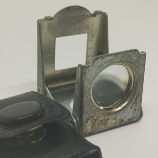 Antigua lupa plegable de bolsillo con estuche