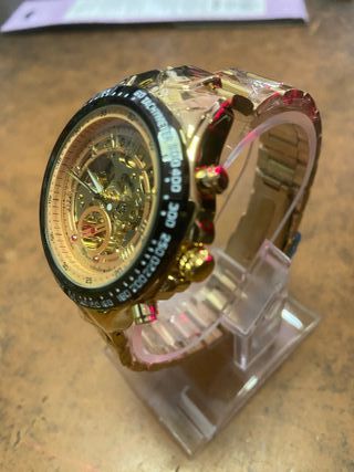 Reloj mecánico dorado