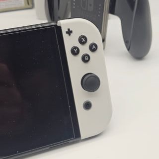 Nintendo Switch OLED bianca e nera + gioco
