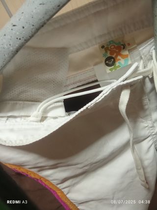 Bañador Roxy marrón-blanco y detalles naranja