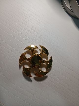 Spinner metálico dorado