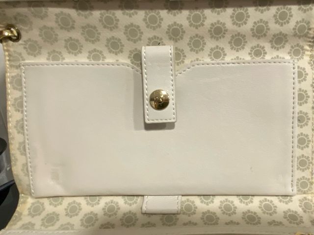 Cartera Swarovski beige y dorada