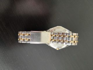 SEIKO Modelo SQ 100 acero dorado y plateado