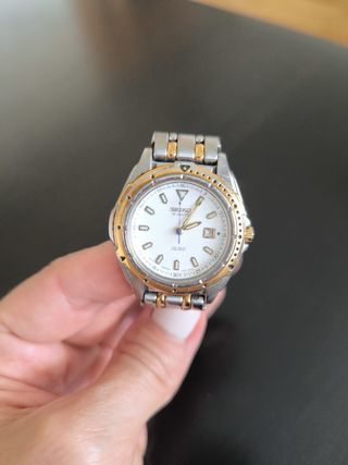 SEIKO Modelo SQ 100 acero dorado y plateado
