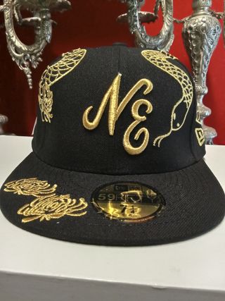 Gorra New Era 59Fifty negra y dorada
Talla 7.1/4