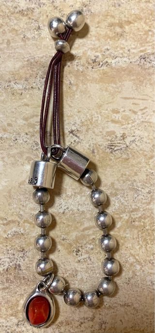 Pulsera plata y cuero marrón