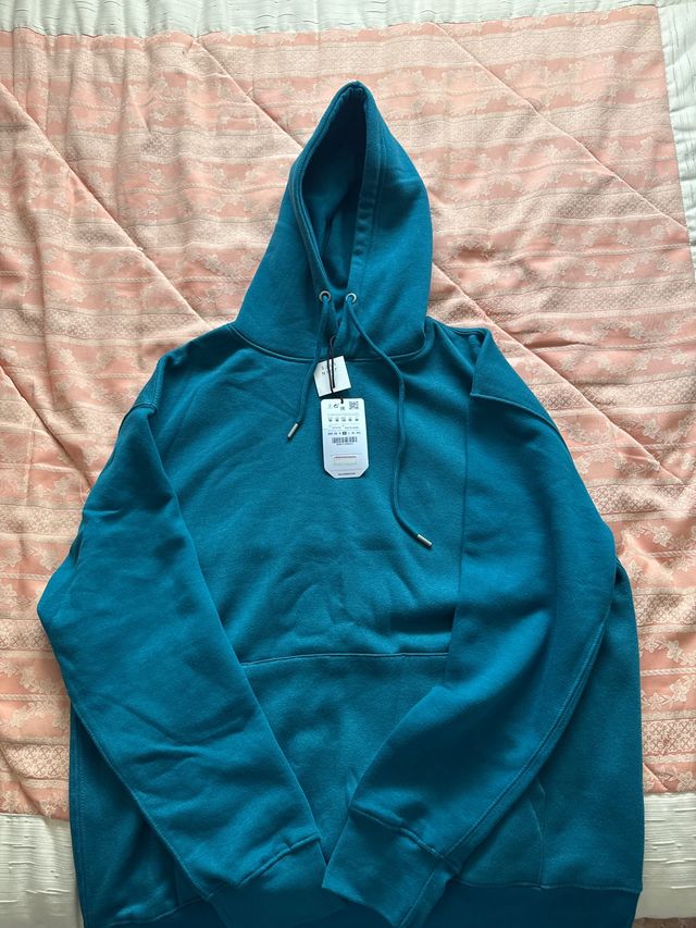 Sudadera turquesa con capucha