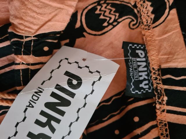 Falda de Pinky naranja y negra única 7.euros