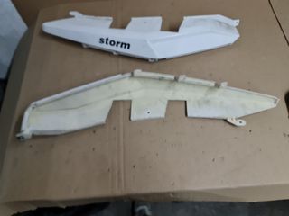 Laterales traseros Storm 125