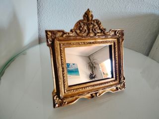 Espejo dorado antiguo