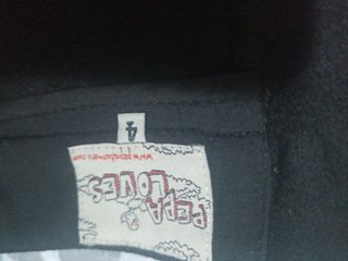 Falda negra plisada