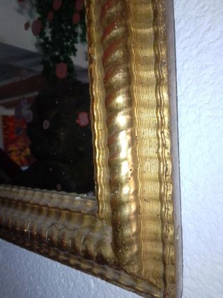 Espejo dorado al oro fino .


