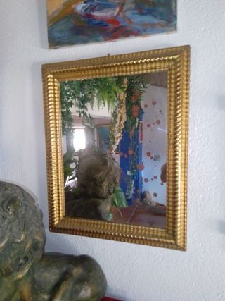 Espejo dorado al oro fino .


