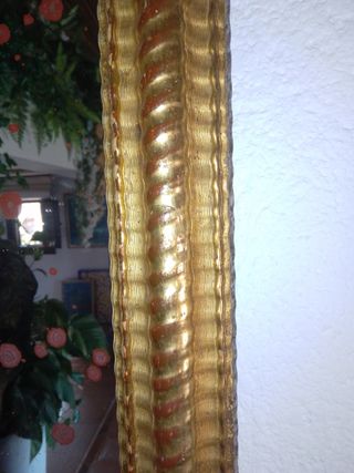 Espejo dorado al oro fino .


