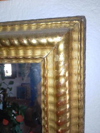 Espejo dorado al oro fino .


