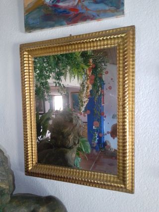 Espejo dorado al oro fino .


