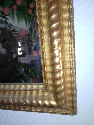 Espejo dorado al oro fino .


