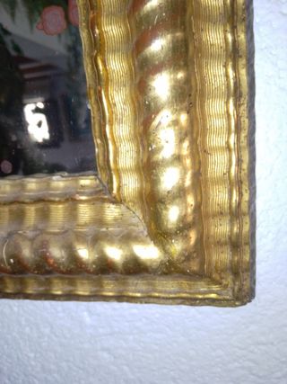 Espejo dorado al oro fino .


