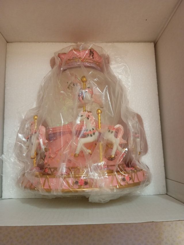 Carrusel musical con luz y música a cuerda