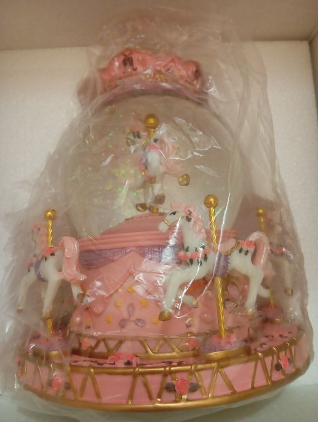 Carrusel musical con luz y música a cuerda