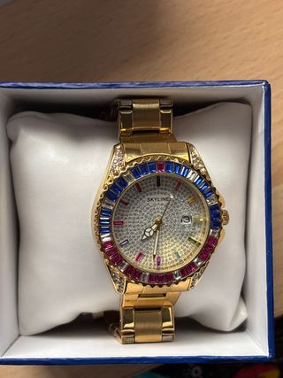 Reloj Skyline dorado