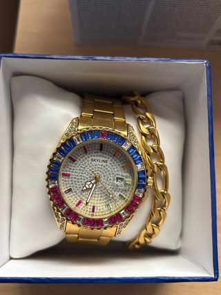 Reloj Skyline dorado