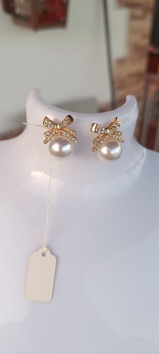 Pendientes perla lazo dorados