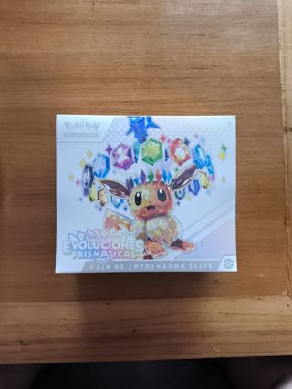 Caja Entrenador Élite Evoluciones Prismática Pokém