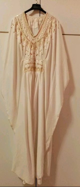 Vestito arabo bianco e oro