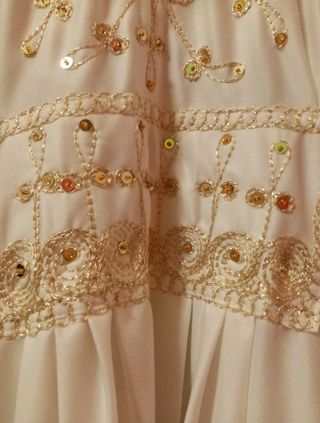 Vestito arabo bianco e oro