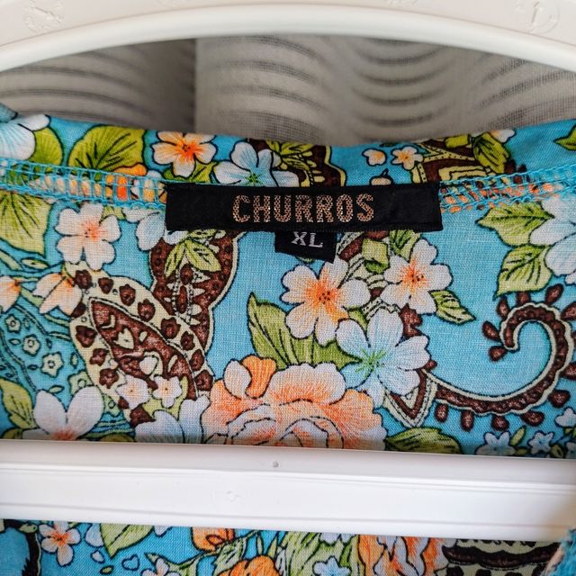 Blusa Churros veste M - Floral/turquesa 