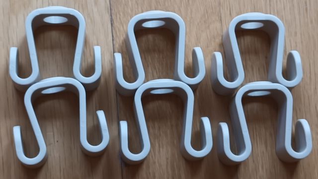 Colgador abatible y 6 colgadores dobles perchas