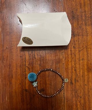 Bracciale con stella e pompon