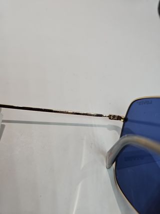Gafas Levis azules y doradas