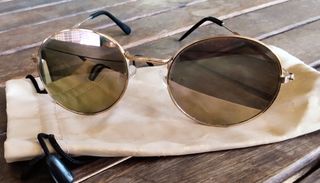 Gafas sol redondas doradas