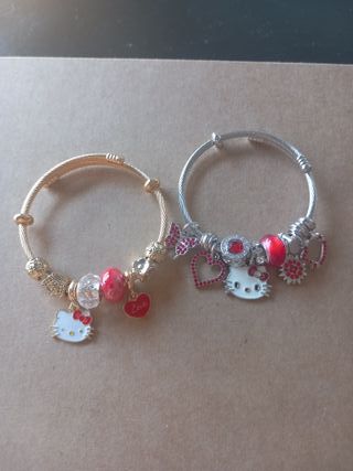 Pulseras Hello Kitty doradas y rojas