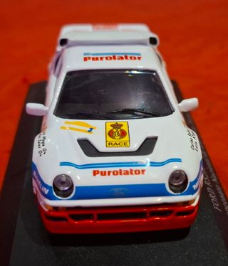 2 coches Carlos sainz Toyota y Ford rs200 1.43 
