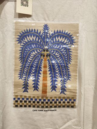 Camiseta blanca con palmera. Nueva con etiquetas