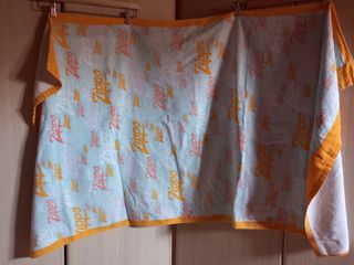 Telo mare Zippo azzurro, arancione e rosso